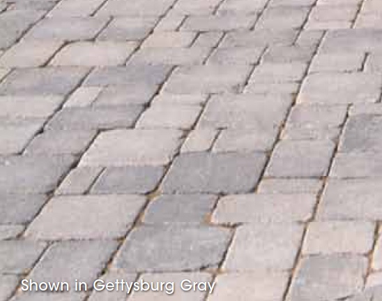 Image of laid brick with a grey worn stone effect by Hanover Prest Brick and available through Westview Concrete.