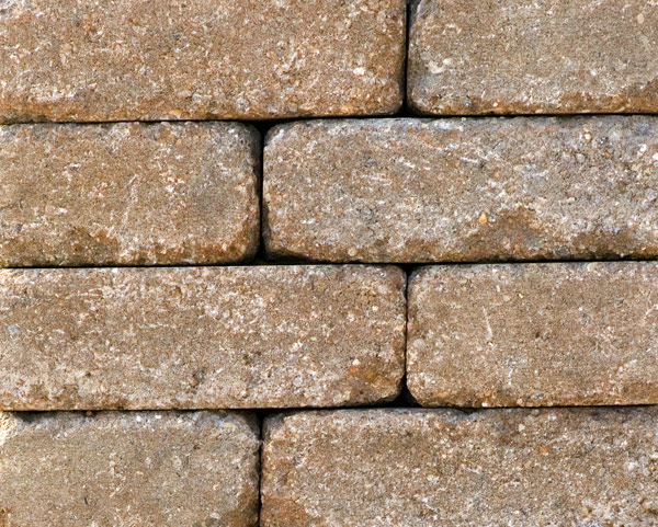 Buff/Pewter concrete stone pieces that are a brown color used in a firepit kit sold at Westview Concrete.