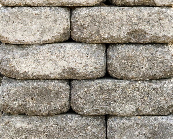 Pewter concrete stone pieces that are a grey color used in a firepit kit sold at Westview Concrete.