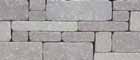 Chapel Stone Firepit Kit Gray Blend Stones that are of various shapes and sizes and light gray colored.