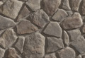 Summerwinds Fieldstone veneer stone, a dark grey, multi-shade irregular shaped stone.