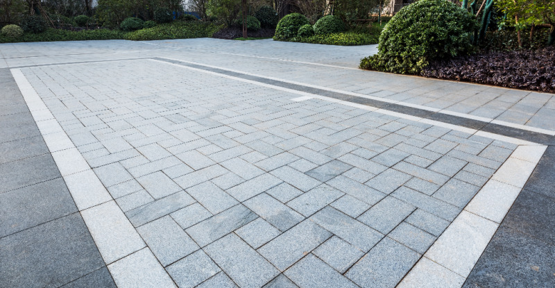 Large patio area made by a variety of grey concrete blocks provided by Westview Concrete Corp.
