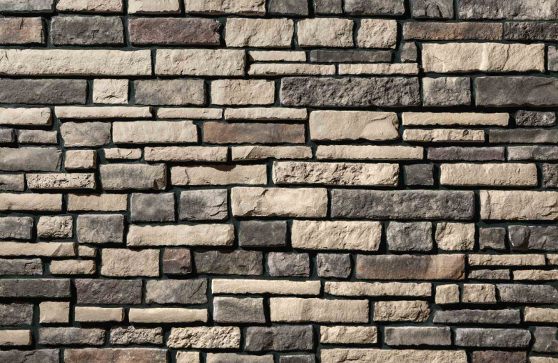 Grey and tan chisel cut ProVia Stone Veneers for sale by Westview Concrete.